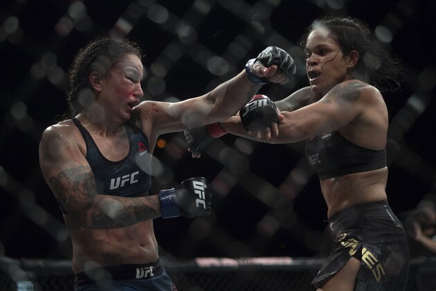 Brazilian fighter Amanda Nunes (R) competes against US fighter Raquel Pennington (L) during their women's bantamweight title fight at the Ultimate Fighting Championship 224 (UFC 224) event at Jeunesse Arena in Rio de Janeiro on May 12, 2018. (Photo by MAURO PIMENTEL / AFP)        (Photo credit should read MAURO PIMENTEL/AFP/Getty Images)