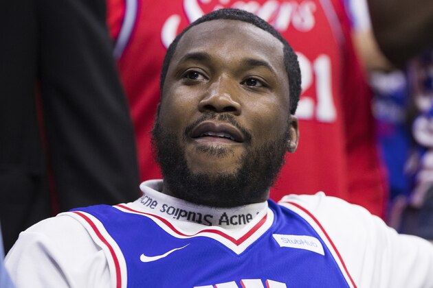 Rapper Meek Mill looks on during the first half in Game 5 of a first-round NBA basketball playoff series between the Miami Heat and the Philadelphia 76ers, Tuesday, April 24, 2018, in Philadelphia. The 76ers won 104-91. (AP Photo/Chris Szagola)