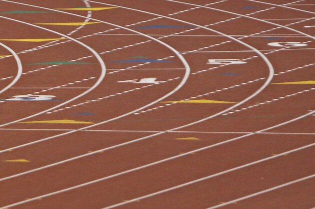 San Antonio Reagan High School's Wyatt Stuckness competes in the boys' 400-meter dash wheelchair event at the UIL State Track & Field meet, Saturday, May 10, 2014, in Austin, Texas.  Stuckness raced using only his right arm. (AP Photo/Michael Thomas)