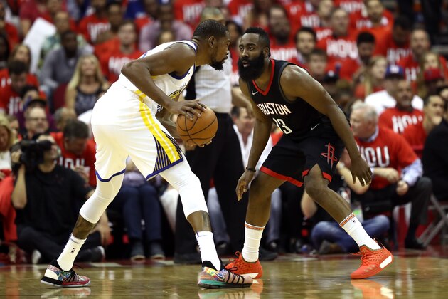 HOUSTON, TX - MAY 14: James Harden #13 of the Houston Rockets defends Kevin Durant #35 of the Golden State Warriors in the first half in Game One of the Western Conference Finals of the 2018 NBA Playoffs at Toyota Center on May 14, 2018 in Houston, Texas. NOTE TO USER: User expressly acknowledges and agrees that, by downloading and or using this photograph, User is consenting to the terms and conditions of the Getty Images License Agreement.  (Photo by Ronald Martinez/Getty Images)