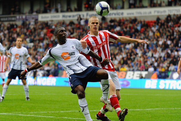 BOLTON, ENGLAND - SEPTEMBER 19: Jlloyd Samuel of Bolton battles with Ryan Shawcross of Stoke during the Barclays Premier League match between Bolton Wanderers and Stoke City at the Reebok Stadium on September 19, 2009 in Bolton, England.  (Photo by Michael Regan/Getty Images)
