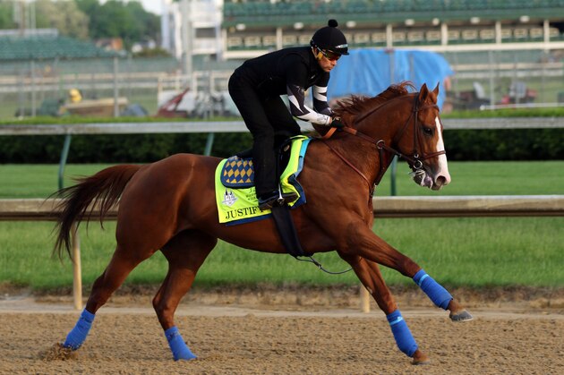LOUISVILLE, KY - MAY 10: Kentucky Derby winner Justify, with exercise rider Humberto Gomez, gallops at Churchill Downs on May 10, 2018 in Louisville, Kentucky. It was his first visit to the track since his Kentucky Derby win five days earlier. (Photo by Mary M. Meek/Eclipse Sportswire/Getty Images)