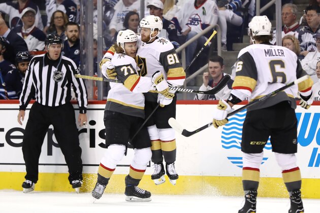 WINNIPEG, MB - MAY 14:  Jonathan Marchessault #81 of the Vegas Golden Knights is congratulated by his teammate William Karlsson #71 after scoring a third period goal against the Winnipeg Jets in Game Two of the Western Conference Finals during the 2018 NHL Stanley Cup Playoffs at Bell MTS Place on May 14, 2018 in Winnipeg, Canada.  (Photo by Elsa/Getty Images)
