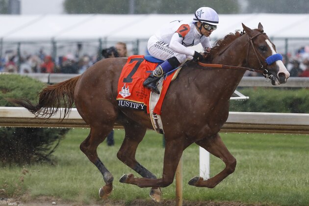 Mike Smith rides Justify through the fourth turn and unto victory during the 144th running of the Kentucky Derby horse race at Churchill Downs Saturday, May 5, 2018, in Louisville, Ky. (AP Photo/John Minchillo)