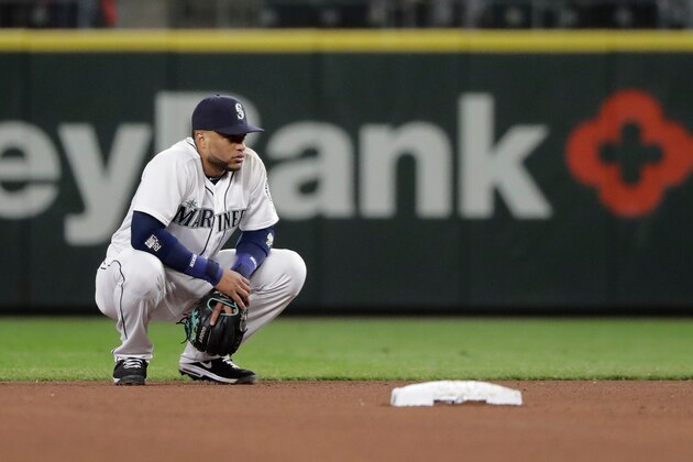 Seattle Mariners second baseman Robinson Cano crouches by the base during a baseball game against the Houston Astros, Monday, April 16, 2018, in Seattle. (AP Photo/Ted S. Warren)