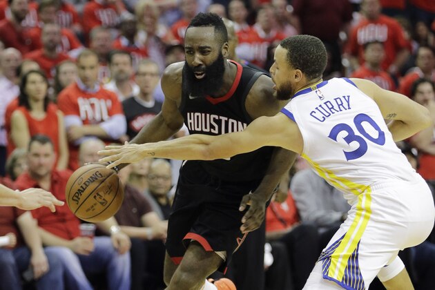 Houston Rockets guard James Harden (13) is pressured by Golden State Warriors guard Stephen Curry (30) during the second half of Game 1 of the NBA basketball Western Conference Finals, Monday, May 14, 2018, in Houston. (AP Photo/David J. Phillip)
