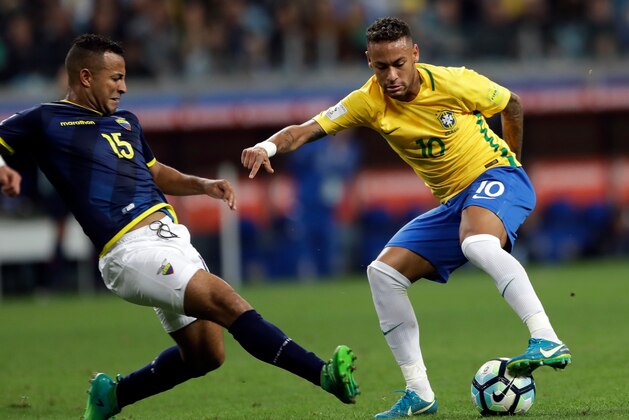 FILE - In this Aug. 31, 2017 file photo, Brazil's Neymar, right, controls the ball against Ecuador's Pedro Quinones, left, during a 2018 World Cup qualifying soccer match in Porto Alegre, Brazil. (AP Photo/Andre Penner, File)