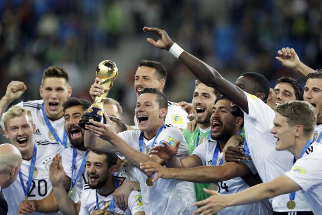 FILE - In this Sunday July 2, 2017 file photo, Germany's Julian Draxler holds the trophy after winning the Confederations Cup final soccer match between Chile and Germany, at the St. Petersburg Stadium, Russia. Germany leads the FIFA rankings again after the 2014 World Cup winner added the Confederations Cup title on Sunday. (AP Photo/Thanassis Stavrakis, File)