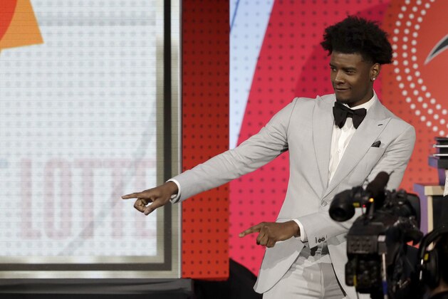 Phoenix Suns forward Josh Jackson reacts after the team won the first pick of the 2018 NBA Draft during the NBA basketball draft lottery Tuesday, May 15, 2018, in Chicago. (AP Photo/Charles Rex Arbogast)