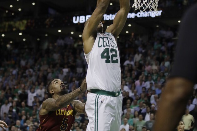 Cleveland Cavaliers guard JR Smith, left, shoves Boston Celtics forward Al Horford (42) as he drives to the basket during the second half in Game 2 of the NBA basketball Eastern Conference finals Tuesday, May 15, 2018, in Boston. Smith was called for a flagrant foul. (AP Photo/Charles Krupa)