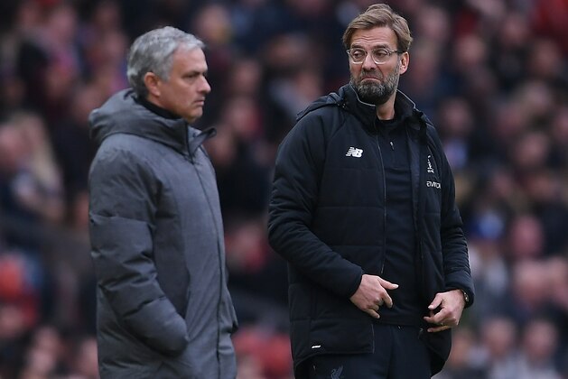 MANCHESTER, ENGLAND - MARCH 10:  Jose Mourinho of Manchester United and Jurgen Klopp of Liverpool look on during the Premier League match between Manchester United and Liverpool at Old Trafford on March 10, 2018 in Manchester, England.  (Photo by Laurence Griffiths/Getty Images)