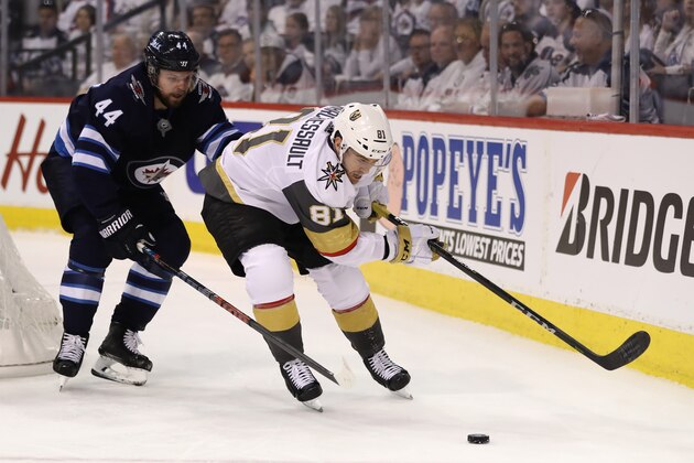 WINNIPEG, MB - MAY 14:  Jonathan Marchessault #81 of the Vegas Golden Knights is defended by Josh Morrissey #44 of the Winnipeg Jets during the third period in Game Two of the Western Conference Finals during the 2018 NHL Stanley Cup Playoffs at Bell MTS Place on May 14, 2018 in Winnipeg, Canada. The Vegas Golden Knights defeated the Winnipeg Jets 3-1.  (Photo by Elsa/Getty Images)