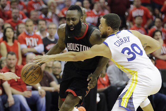 Houston Rockets guard James Harden (13) is pressured by Golden State Warriors guard Stephen Curry (30) during the second half of Game 1 of the NBA basketball Western Conference Finals, Monday, May 14, 2018, in Houston. (AP Photo/David J. Phillip)
