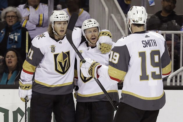 Vegas Golden Knights' Jonathan Marchessault, center, celebrates his goal with teammates William Karlsson, left, and Reilly Smith (19) during the second period of Game 6 of an NHL hockey second-round playoff series against the San Jose Sharks Sunday, May 6, 2018, in San Jose, Calif. (AP Photo/Marcio Jose Sanchez)