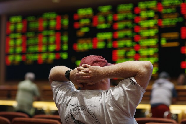 A man watches a baseball game in the sports book at the South Point hotel-casino, Monday, May 14, 2018, in Las Vegas. The Supreme Court on Monday gave its go-ahead for states to allow gambling on sports across the nation, striking down a federal law that barred betting on football, basketball, baseball and other sports in most states. (AP Photo/John Locher)