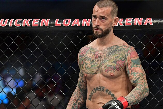CM Punk stands in his corner before a welterweight bout at UFC 203 on Saturday, Sept. 10, 2016, in Cleveland. Mickey Gall won via submission. (AP Photo/David Dermer) CM Punk stands in his corner before a welterweight bout at UFC 203 on Saturday, Sept. 10, 2016, in Cleveland. Mickey Gall won via submission. (AP Photo/David Dermer)