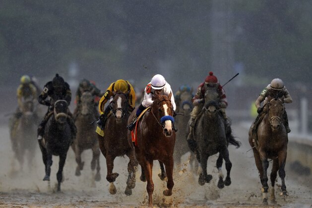Mike Smith rides Justify to victory during the 144th running of the Kentucky Derby horse race at Churchill Downs Saturday, May 5, 2018, in Louisville, Ky. (AP Photo/Darron Cummings)