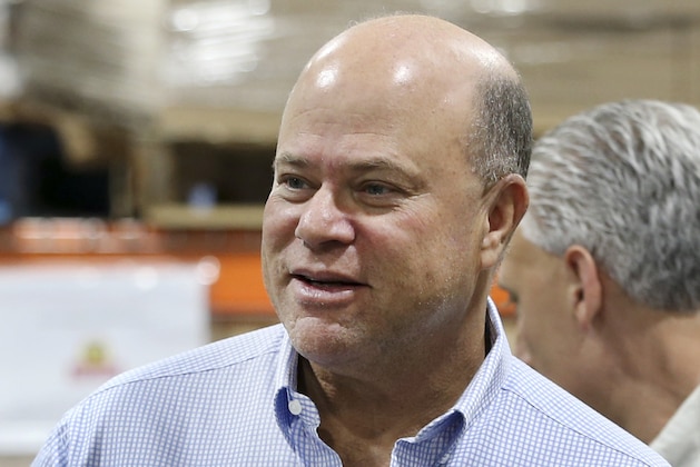 FILE - Int his May 10, 2016, file photo, billionaire hedge fund manager David Tepper mingles during a grand opening of rock star and philanthropist Jon Bon Jovi's Jon Bon Jovi Soul Foundation Soul Kitchen and B.E.A.T. Center, which stands for Bringing Everyone All Together, in Toms River, N.J. People familiar with the situation say Tepper has agreed to buy the Carolina Panthers from team founder Jerry Richardson for a record $2.2 billion. The people spoke to The Associated Press on Tuesday, May 15, 2018, on condition of anonymity because the team has not yet announced the sale. The purchase is subject to a vote at the NFL owners meeting next week in Atlanta. (AP Photo/Mel Evans, File)