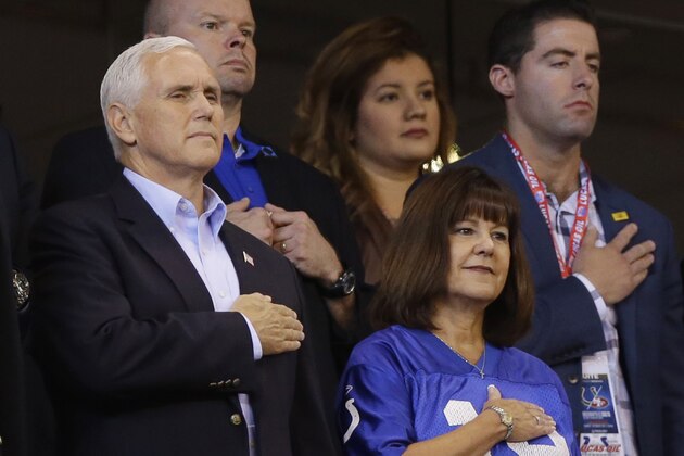 Vice President Mike Pence and his wife, Karen, stand during the playing of the national anthem before an NFL football game between the Indianapolis Colts and the San Francisco 49ers, Sunday, Oct. 8, 2017, in Indianapolis. (AP Photo/Michael Conroy)