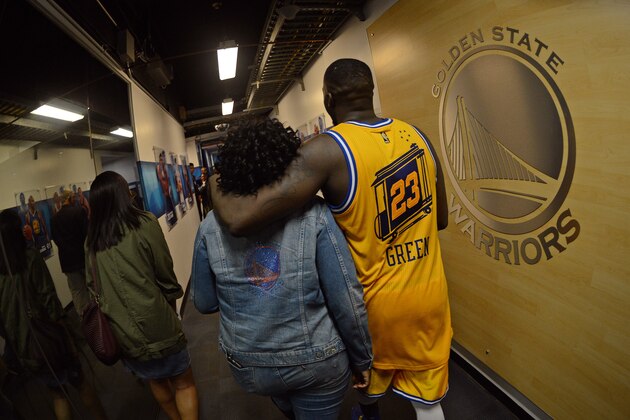 OAKLAND, CA - MARCH 1:  Draymond Green #23 of the Golden State Warriors hugs his mom as he walks to the locker room after the game against the Atlanta Hawks on March 1, 2016 at Oracle Arena in Oakland, California. NOTE TO USER: User expressly acknowledges and agrees that, by downloading and or using this photograph, user is consenting to the terms and conditions of Getty Images License Agreement. Mandatory Copyright Notice: Copyright 2016 NBAE (Photo by Noah Graham/NBAE via Getty Images)