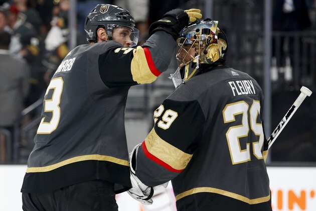Vegas Golden Knights defenseman Brayden McNabb, left, celebrates with goaltender Marc-Andre Fleury after the team's 4-2 win against the Winnipeg Jets during Game 3 of the NHL hockey playoffs Western Conference finals Wednesday, May 16, 2018, in Las Vegas. (AP Photo/John Locher)