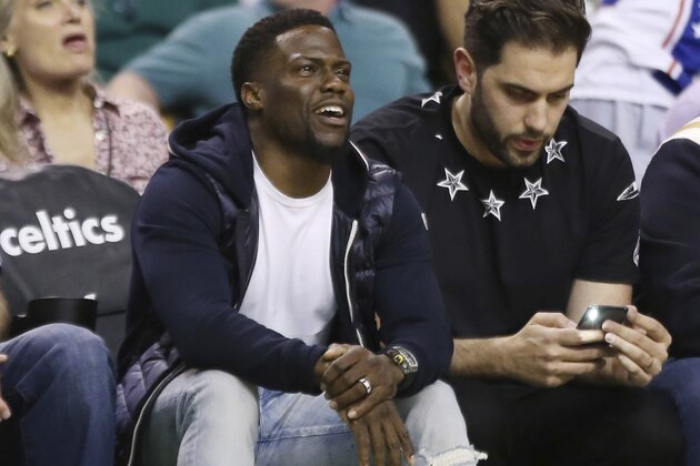Actor and comedian Kevin Hart watches during the first quarter of Game 2 of an NBA basketball second-round playoff series between the Boston Celtics and the Philadelphia 76ers, Thursday, May 3, 2018, in Boston. (AP Photo/Elise Amendola)