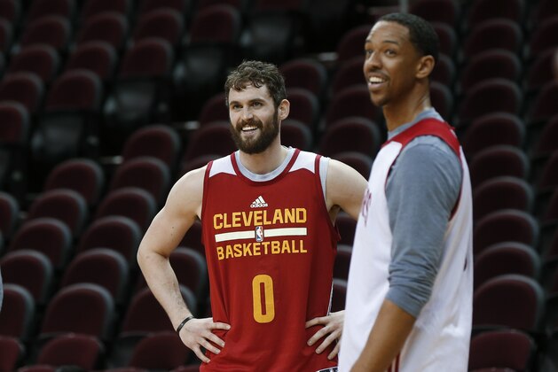 Cleveland Cavaliers forward Kevin Love (0) smiles with Channing Frye during practice for Game 4 of basketball's NBA Finals against the Golden State Warriors in Cleveland, Thursday, June 9, 2016. (AP Photo/Paul Sancya)