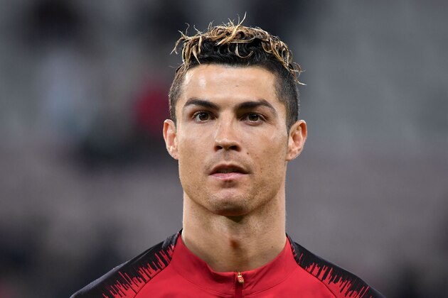 Portugal's forward Cristiano Ronaldo stands prior to the international friendly football match between Portugal and Netherlands at Stade de Geneve stadium in Geneva on March 26, 2018. / AFP PHOTO / Fabrice COFFRINI        (Photo credit should read FABRICE COFFRINI/AFP/Getty Images)