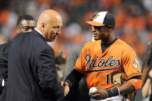 BALTIMORE, MD - SEPTEMBER 29:  Adam Jones #10 of the Baltimore Orioles talks with Cal Ripken Jr. before the game against the Boston Red Sox at Oriole Park at Camden Yards on September 29, 2012 in Baltimore, Maryland.  (Photo by G Fiume/Getty Images)