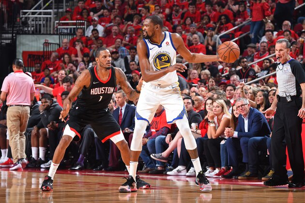 HOUSTON, TX - MAY 16:  Kevin Durant #35 of the Golden State Warriors handles the ball against Trevor Ariza #1 of the Houston Rockets during Game Two of the Western Conference Finals of the 2018 NBA Playoffs on May 16, 2018 at the Toyota Center in Houston, Texas. NOTE TO USER: User expressly acknowledges and agrees that, by downloading and or using this photograph, User is consenting to the terms and conditions of the Getty Images License Agreement. Mandatory Copyright Notice: Copyright 2018 NBAE (Photo by Andrew D. Bernstein/NBAE via Getty Images)