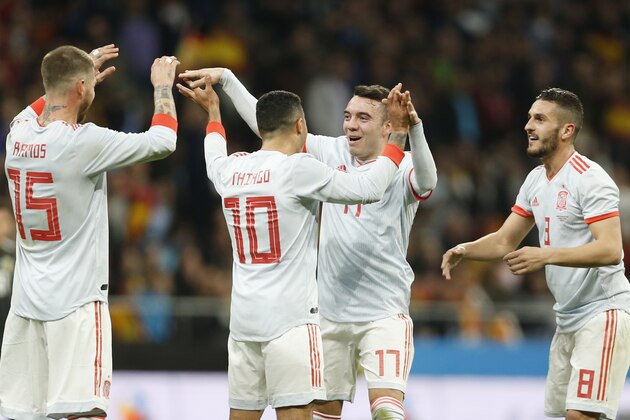 Spain's Sergio Ramos, Thiago Alcantara, Iago Aspas, and Koke Resurreccion, from left, celebrate after Aspas scored the team's fifth goal during the international friendly soccer match between Spain and Argentina at the Wanda Metropolitano stadium in Madrid, Spain, Tuesday, March 27, 2018. (AP Photo/Francisco Seco)
