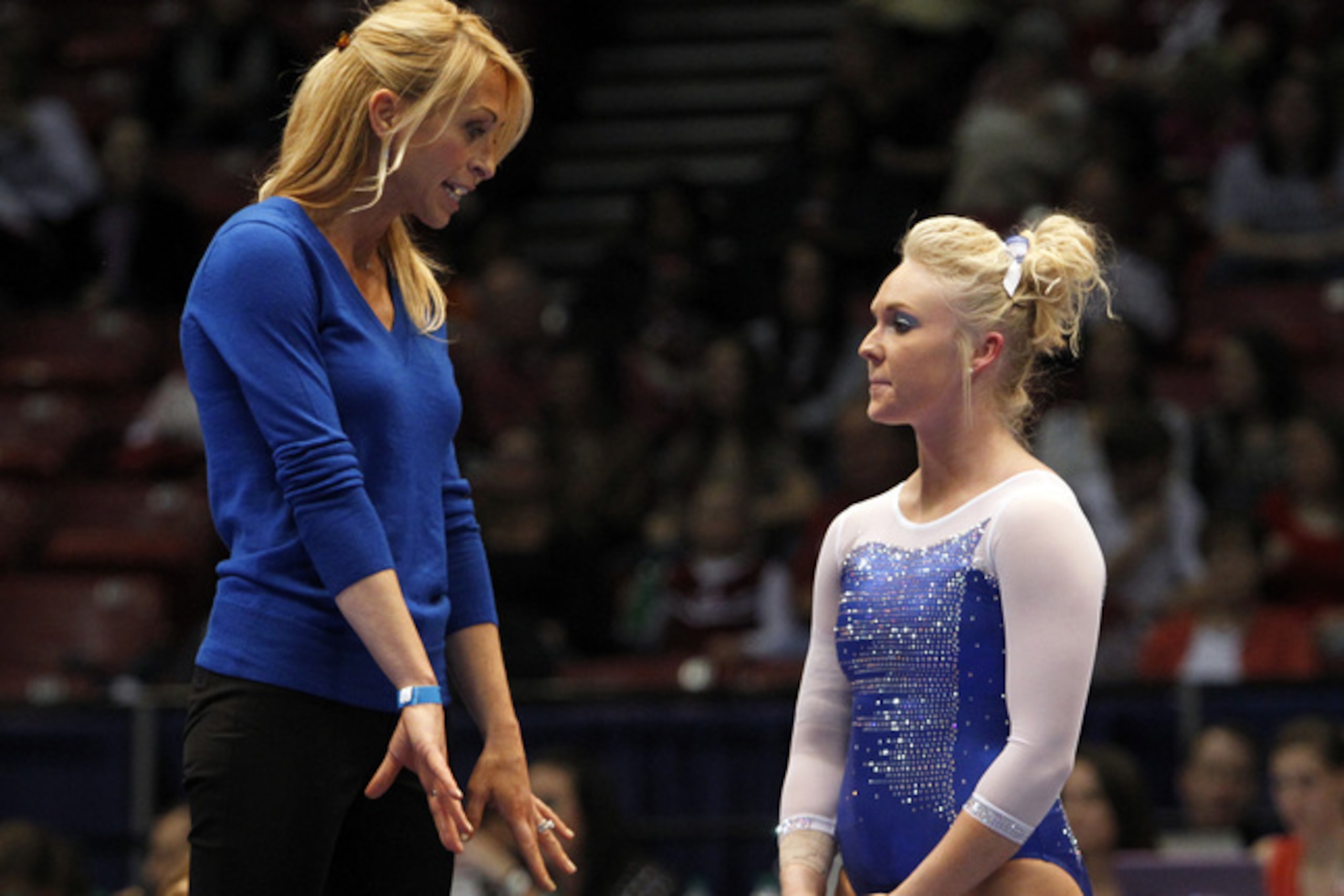 Florida coach Rhonda Faehn talks with Rachel Spicer during the NCAA women's gymnastics championships on Friday, April 18, 2014, in Birmingham, Ala. (AP Photo/Butch Dill)