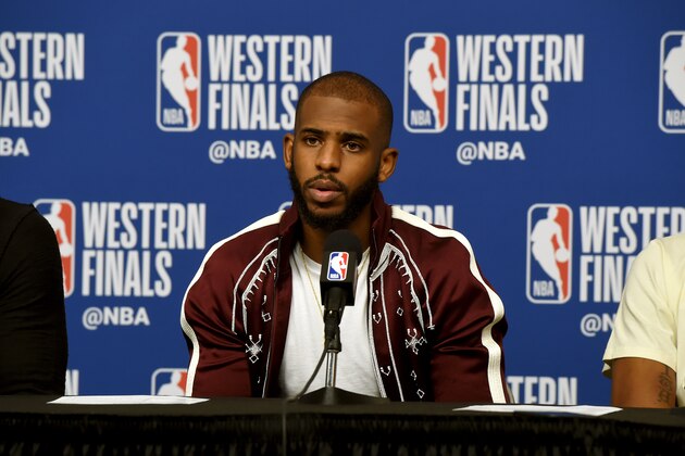 HOUSTON, TX - MAY 16:  Chris Paul #3 of the Houston Rockets talks to the media after the game against the Golden State Warriors in Game Two of the Western Conference Finals of the 2018 NBA Playoffs on May 16, 2018 at the Toyota Center in Houston, Texas. NOTE TO USER: User expressly acknowledges and agrees that, by downloading and or using this photograph, User is consenting to the terms and conditions of the Getty Images License Agreement. Mandatory Copyright Notice: Copyright 2018 NBAE (Photo by Bill Baptist/NBAE via Getty Images)