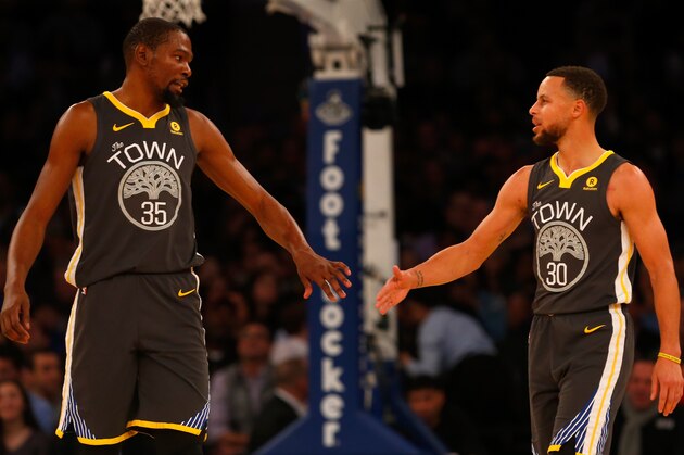 NEW YORK, NY - FEBRUARY 26:  (NEW YORK DAILIES OUT)    Stephen Curry #30 and Kevin Durant #35 of the Golden State Warriors in action against the New York Knicks at Madison Square Garden on February 26, 2018 in New York City. The Warriors defeated the Knicks 125-111. NOTE TO USER: User expressly acknowledges and agrees that, by downloading and/or using this Photograph, user is consenting to the terms and conditions of the Getty Images License Agreement.  (Photo by Jim McIsaac/Getty Images)