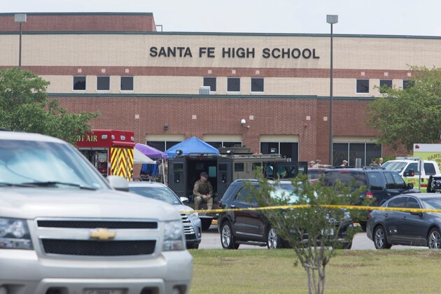 Emergency crews gather in the parking lot of Santa Fe High School where at least eight people were killed on May 18, 2018 in Santa Fe, Texas. - At least eight people were killed when a student opened fire at his Texas high school on May 18, 2018, as President Donald Trump expressed 'heartbreak' over the latest deadly school shooting in the United States. The shooting took place as classes were beginning for the day at Santa Fe High School in the city of the same name, located about 30 miles (50 kilometers) southeast of Houston.'There are multiple fatalities,' Harris County Sheriff Ed Gonzalez told reporters. 'There could be anywhere between eight to 10, the majority being students.' (Photo by Daniel KRAMER / AFP)        (Photo credit should read DANIEL KRAMER/AFP/Getty Images)