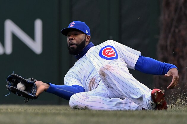 Chicago Cubs right fielder Jason Heyward catches a fly ball hit by Atlanta Braves' Ozzie Albies during the eighth inning of a baseball game on Friday, April 13, 2018, in Chicago. (AP Photo/Matt Marton)