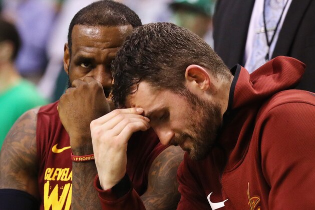 BOSTON, MA - MAY 15:  LeBron James #23 and Kevin Love #0 of the Cleveland Cavaliers react on the bench in the second half against the Boston Celtics during Game Two of the 2018 NBA Eastern Conference Finals at TD Garden on May 15, 2018 in Boston, Massachusetts. NOTE TO USER: User expressly acknowledges and agrees that, by downloading and or using this photograph, User is consenting to the terms and conditions of the Getty Images License Agreement.  (Photo by Maddie Meyer/Getty Images)