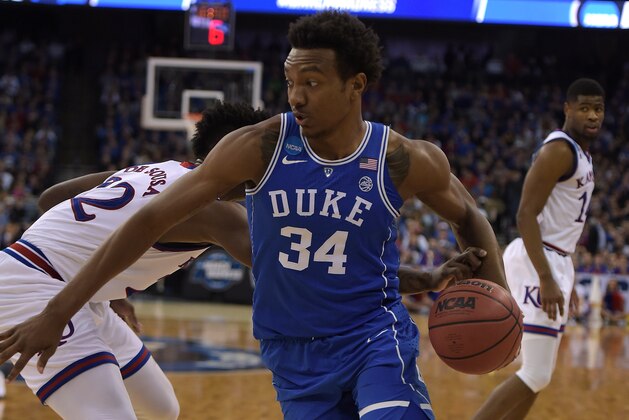 OMAHA, NE - MARCH 25: Wendell Carter, Jr. #34 of the Duke Blue Devils moves the ball against Silvio De Sousa #22 of the Kansas Jayhawks during the 2018 NCAA Men's Basketball Tournament Midwest Regional Final at CenturyLink Center on March 25, 2018 in Omaha, Nebraska. (Photo by Lance King/Getty Images)