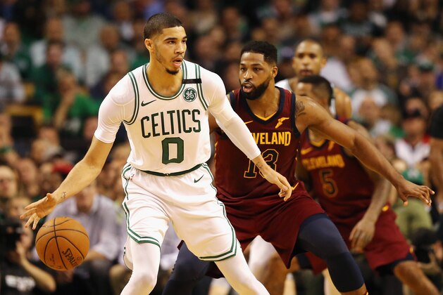 BOSTON, MA - MAY 15:  Jayson Tatum #0 of the Boston Celtics handles the ball against Tristan Thompson #13 of the Cleveland Cavaliers in the first half during Game Two of the 2018 NBA Eastern Conference Finals at TD Garden on May 15, 2018 in Boston, Massachusetts. NOTE TO USER: User expressly acknowledges and agrees that, by downloading and or using this photograph, User is consenting to the terms and conditions of the Getty Images License Agreement.  (Photo by Maddie Meyer/Getty Images)