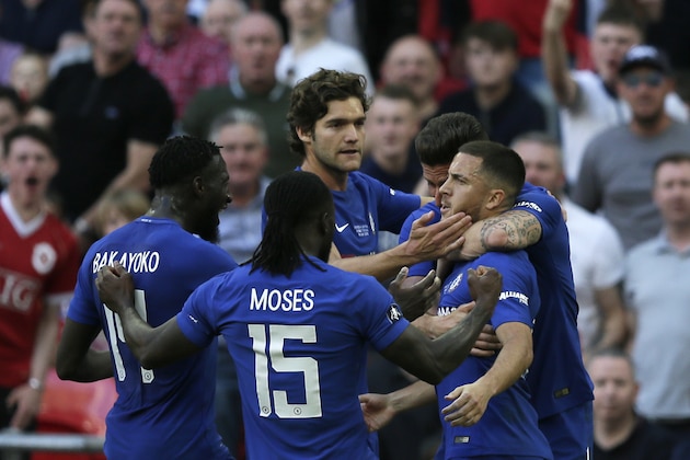 Chelsea's Eden Hazard, right, celebrates after scoring the opening goal during the English FA Cup final soccer match between Chelsea and Manchester United at Wembley stadium in London, Saturday, May 19, 2018. (AP Photo/Tim Ireland)