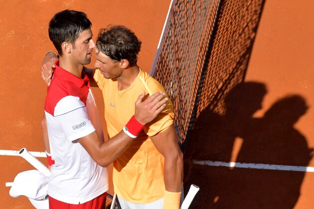 Spain's Rafael Nadal (R) is congratulated by Serbia's Novak Djokovic after winning their semi final match at Rome's ATP Tennis Open tournament at the Foro Italico, on May 19, 2018 in Rome. (Photo by TIZIANA FABI / AFP)        (Photo credit should read TIZIANA FABI/AFP/Getty Images)