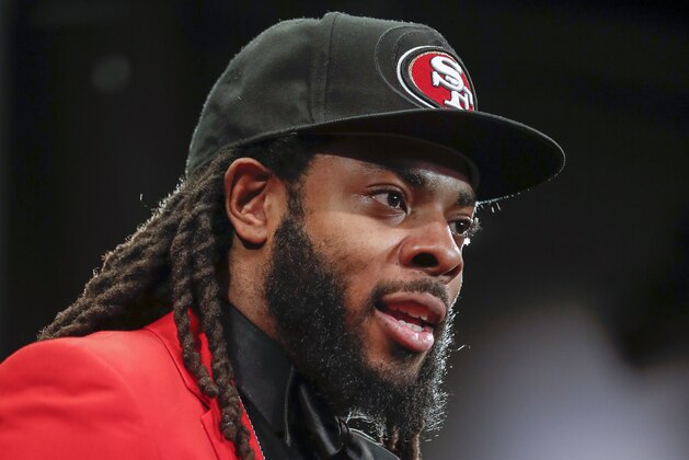San Francisco 49ers new cornerback Richard Sherman answers questions during an NFL football news conference in Santa Clara, Calif., Tuesday, March 20, 2018. Sherman agreed to a three-year deal with the 49ers. (AP Photo/Tony Avelar)