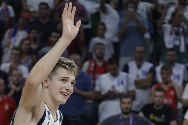 Slovenia's Luka Doncic waves the fans after Slovenia winning the Eurobasket European Basketball Championship final match against Serbia, in Istanbul, Sunday, Sept. 17. 2017. (AP Photo/Lefteris Pitarakis)