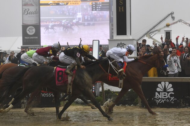 Justify with Mike Smith atop wins the 143rd Preakness Stakes horse race at Pimlico race track, Saturday, May 19, 2018, in Baltimore. Bravazo with Luis Saez aboard wins second with Tenfold with Ricardo Santana Jr. atop places. (AP Photo/Mike Stewart)