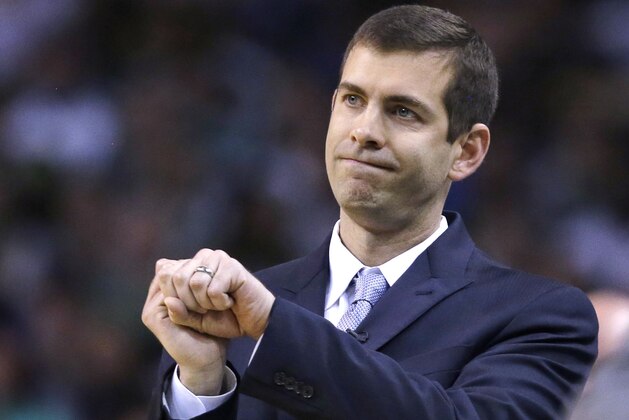 FILE- In this Wednesday, May 9, 2018 photo, Boston Celtics head coach Brad Stevens gestures during the first quarter of Game 5 of an NBA basketball playoff series in Boston. In just his fifth season Stevens has endeared himself to a championship-driven city after helping Boston make in improbable run back to the conference finals.  (AP Photo/Charles Krupa, File)