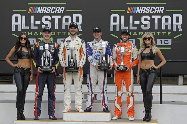 Alex Bowman, Daniel Suarez, AJ Allmendinger and Chase Elliott, from second from left, pose with trophies in Victory lane after the NASCAR Open auto race at Charlotte Motor Speedway in Concord, N.C., Saturday, May 19, 2018. Bowman, Suarez and Allmendinger won the three segments of the race. Chase Elliott won the fan vote. All four drivers advance to the All-Star race. (AP Photo/Chuck Burton)