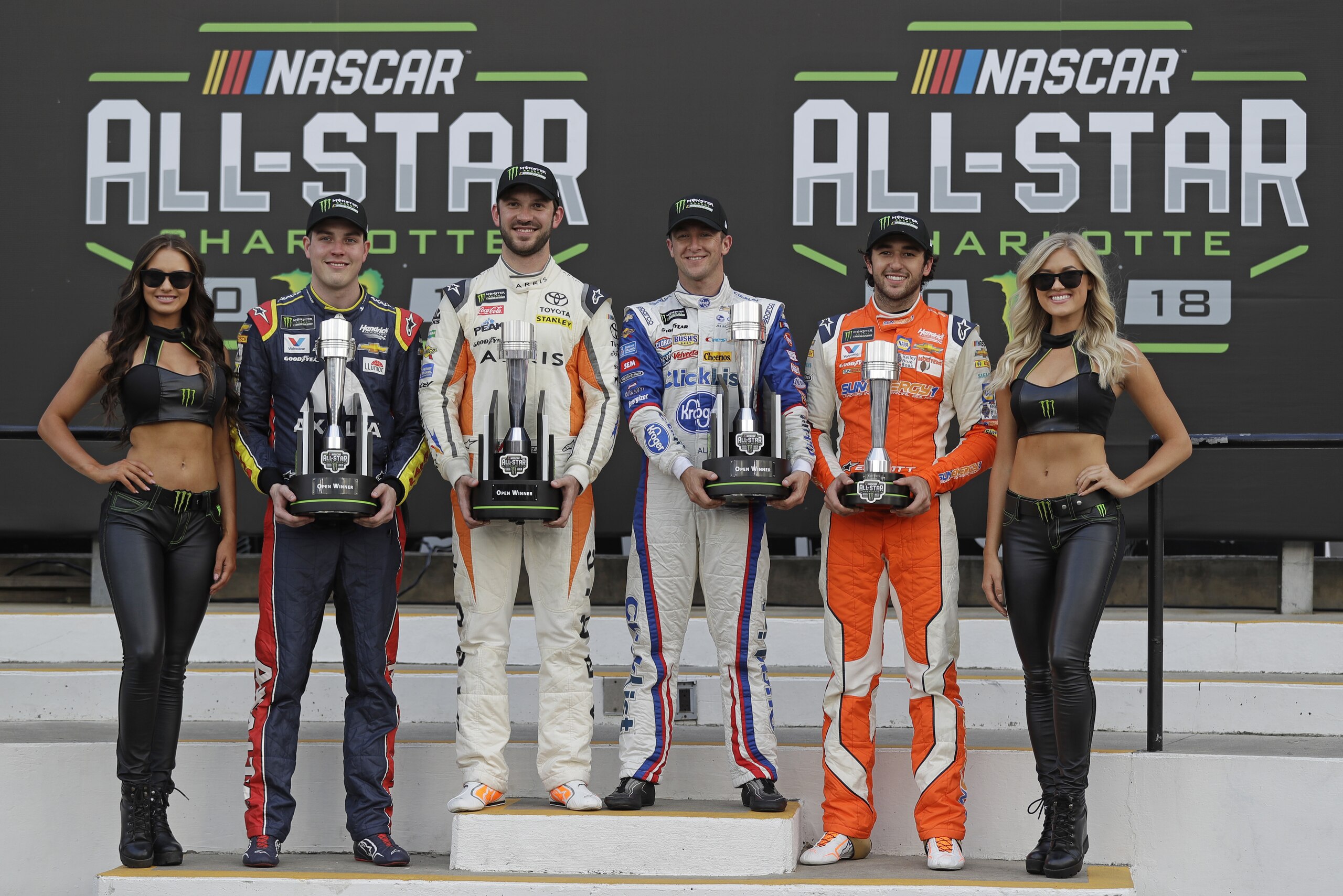 Alex Bowman, Daniel Suarez, AJ Allmendinger and Chase Elliott, from second from left, pose with trophies in Victory lane after the NASCAR Open auto race at Charlotte Motor Speedway in Concord, N.C., Saturday, May 19, 2018. Bowman, Suarez and Allmendinger won the three segments of the race. Chase Elliott won the fan vote. All four drivers advance to the All-Star race. (AP Photo/Chuck Burton) Alex Bowman, Daniel Suarez, AJ Allmendinger and Chase Elliott, from second from left, pose with trophies in Victory lane after the NASCAR Open auto race at Charlotte Motor Speedway in Concord, N.C., Saturday, May 19, 2018. Bowman, Suarez and Allmendinger won the three segments of the race. Chase Elliott won the fan vote. All four drivers advance to the All-Star race. (AP Photo/Chuck Burton)