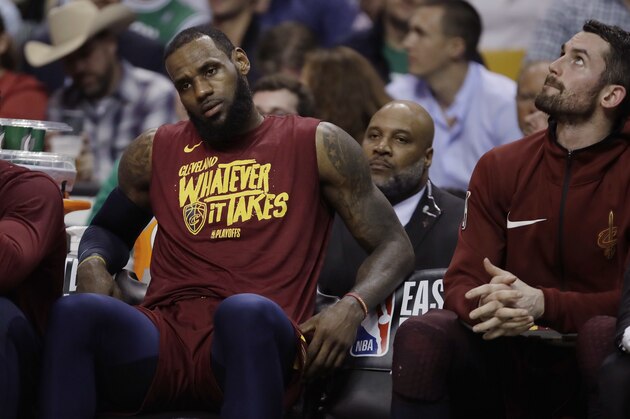 Cleveland Cavaliers forward LeBron James, left, and center Kevin Love sit on the bench during the second half in Game 2 of the team's NBA basketball Eastern Conference finals against the Boston Celtics, Tuesday, May 15, 2018, in Boston. (AP Photo/Charles Krupa)