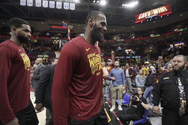 Cleveland Cavaliers' LeBron James, center, and Tristan Thompson walk off the court after the team's 116-86 win over the Boston Celtics in Game 3 of the NBA basketball Eastern Conference finals Saturday, May 19, 2018, in Cleveland. (AP Photo/Tony Dejak)