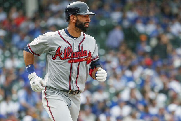 Atlanta Braves' Jose Bautista watches his three-run home run off Chicago Cubs' Jose Quintana during the fifth inning of a baseball game, Monday, May 14, 2018, in Chicago. Braves' Nick Markakis and Tyler Flowers scored on the play. (AP Photo/Kamil Krzaczynski)